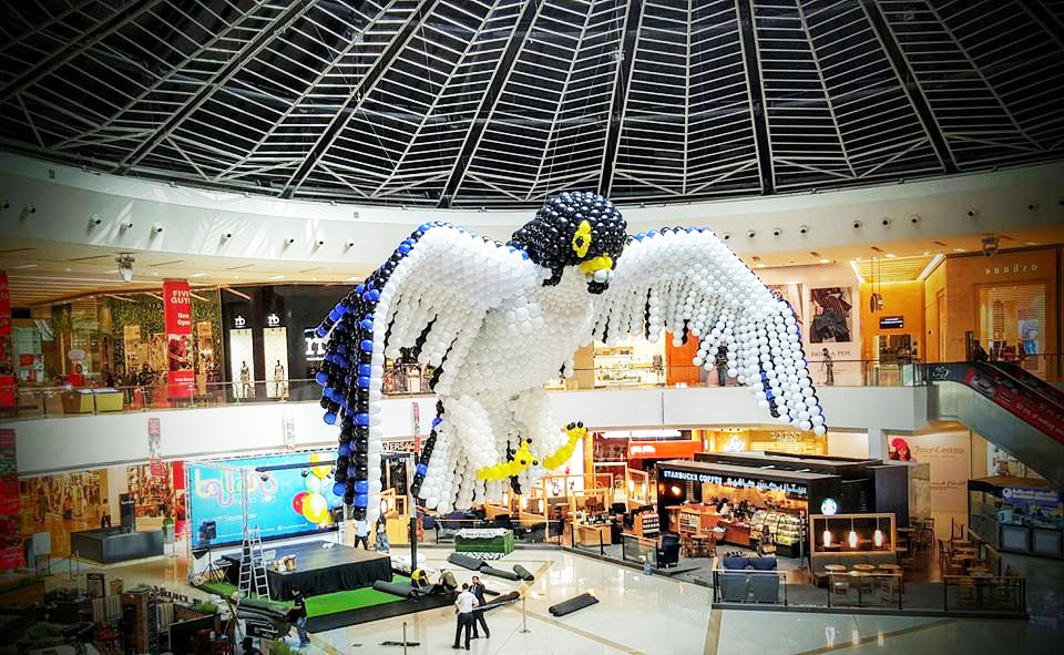 Large-scale falcon balloon sculpture at Dubai Marina Mall during the Bubbles and Balloons Festival — Out of Thin Air